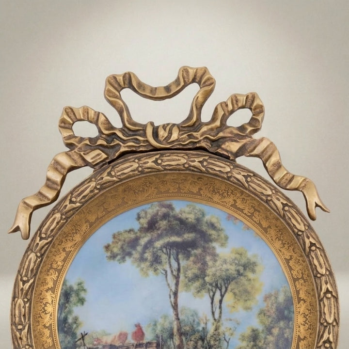 king charles circular decorative plate with bow crest and nature scene