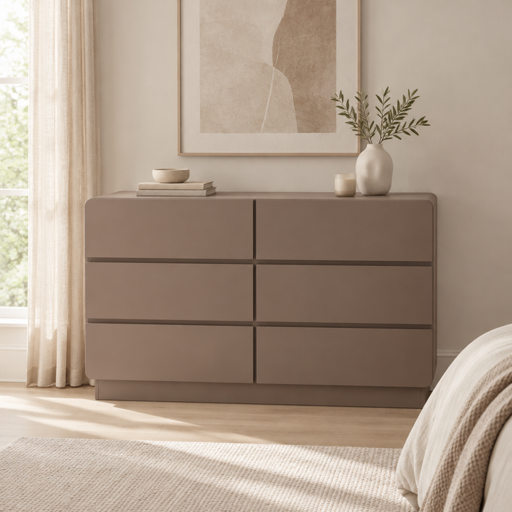 Aster taupe six-drawer dresser styled in a neutral bedroom