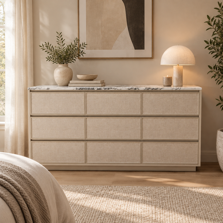 Calista marble-top fabric dresser styled in a neutral bedroom
