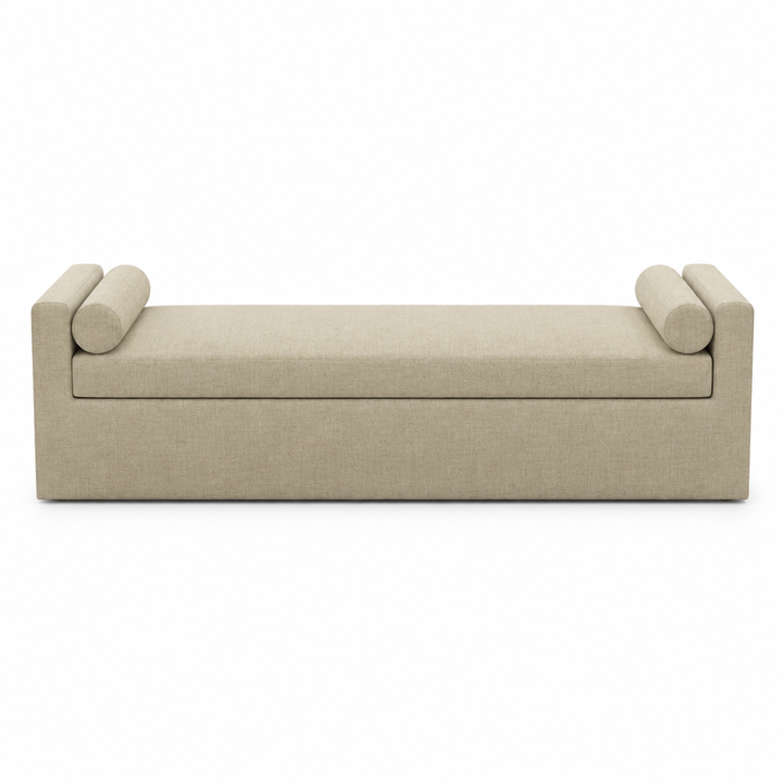 Camille cream upholstered bolster bench, front view on white