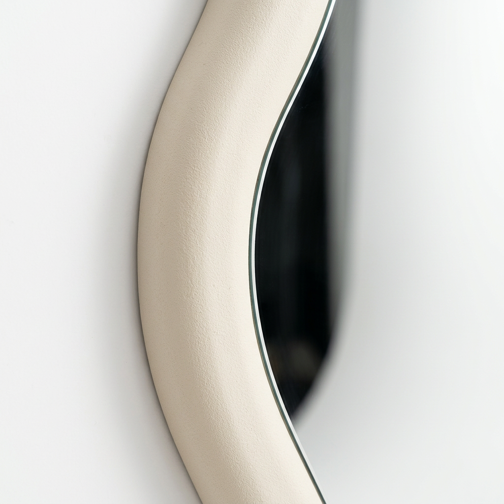 Detail of the Aurelia mirror’s cream textured frame
