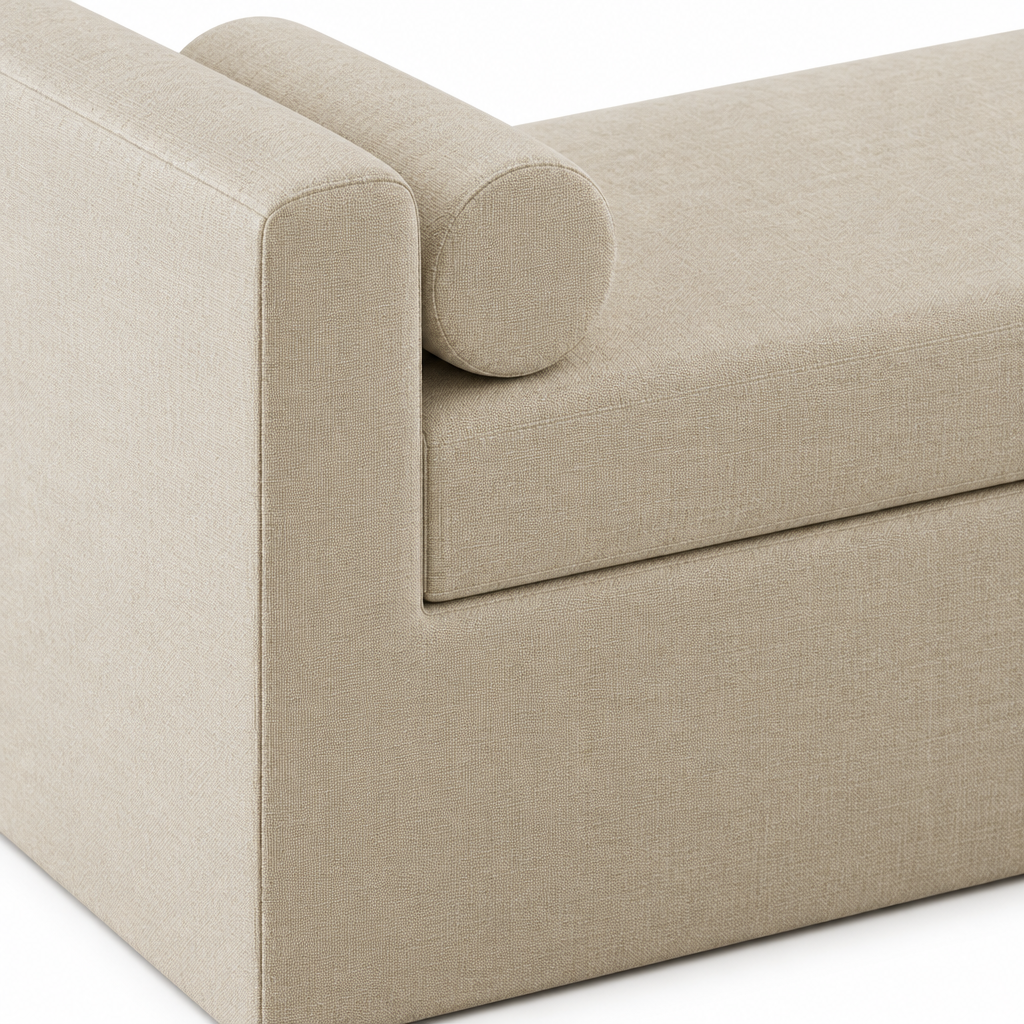 Detail of the Camille bench’s cream upholstery and cylindrical bolster