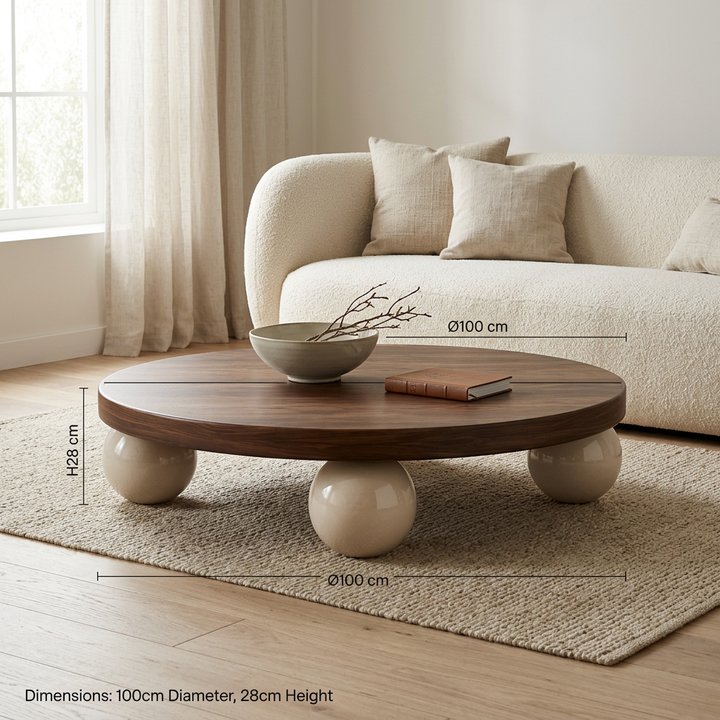 Doro walnut and ivory sphere-base coffee table styled in a living room