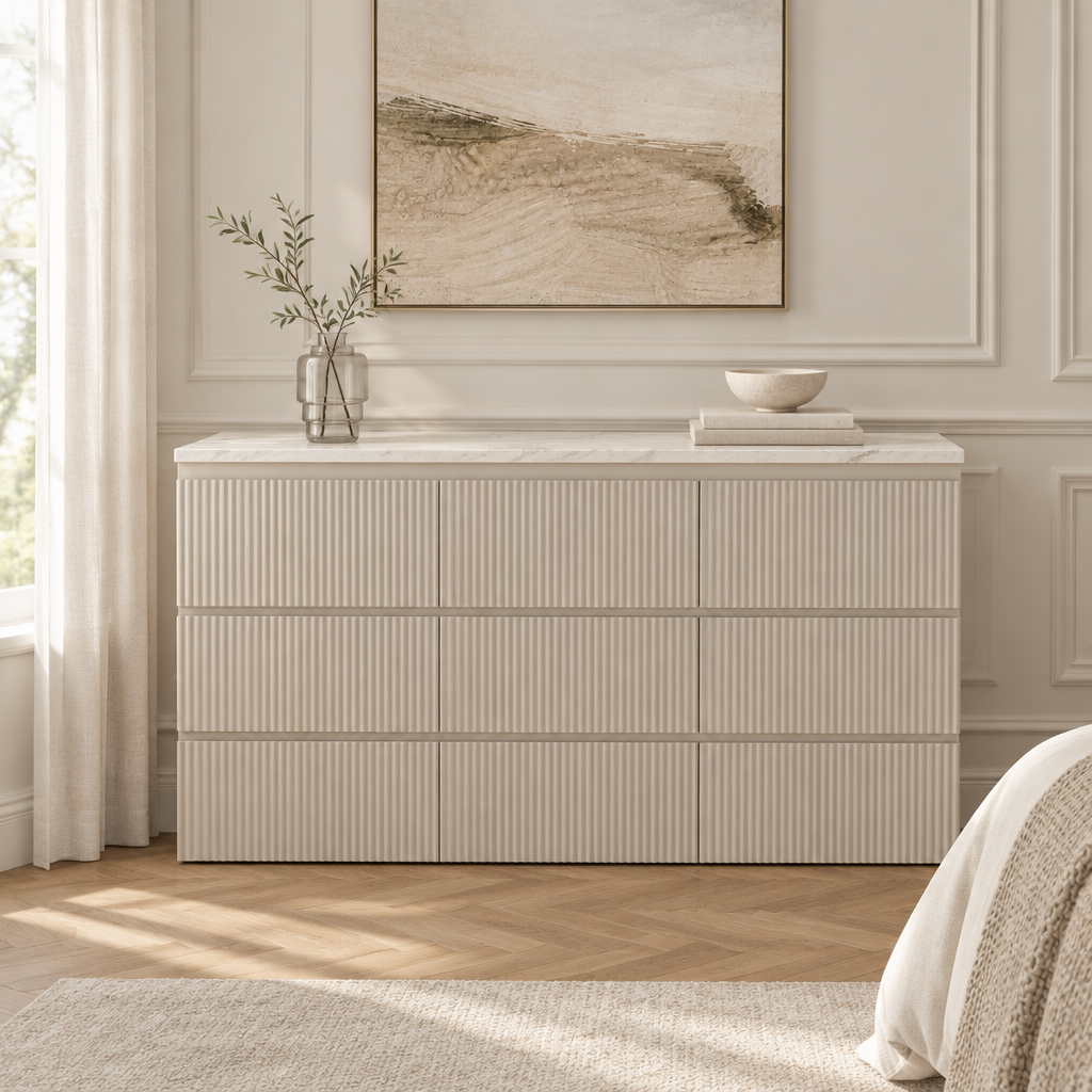 Evelise marble-top fluted dresser styled in a neutral bedroom
