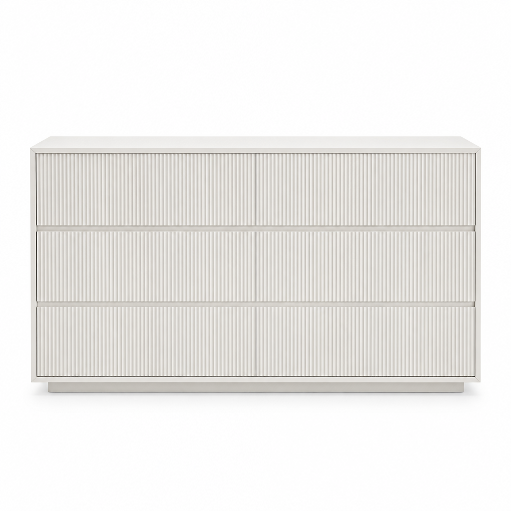 Front view of the Isola white fluted three-drawer dresser on white