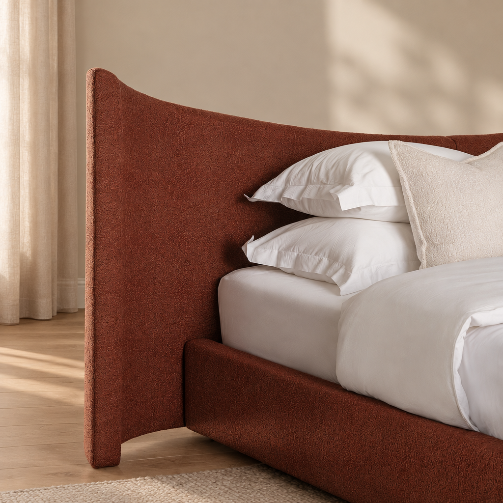 Wingback bed in a warm beige and wood interior