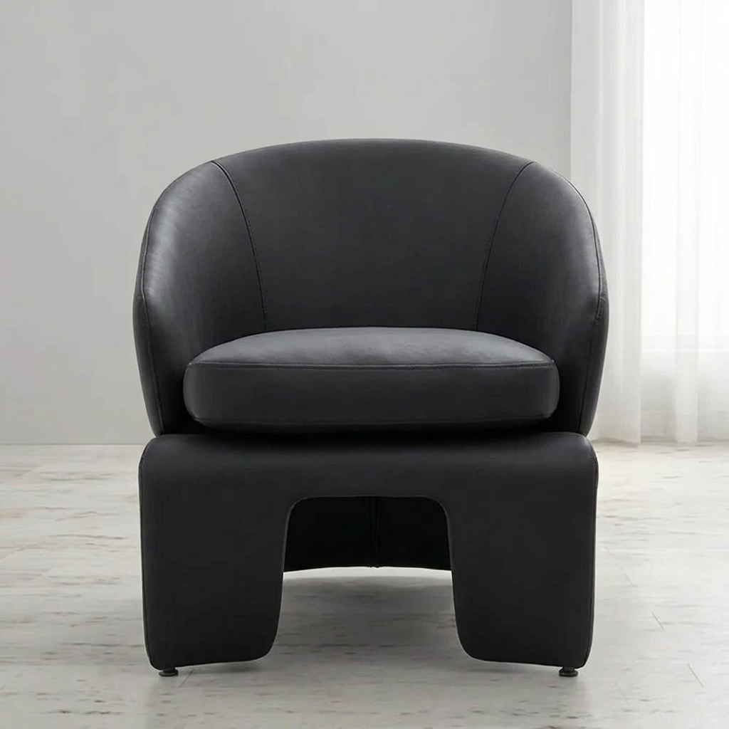 Darsen deep grey armchair, front view in a neutral living room