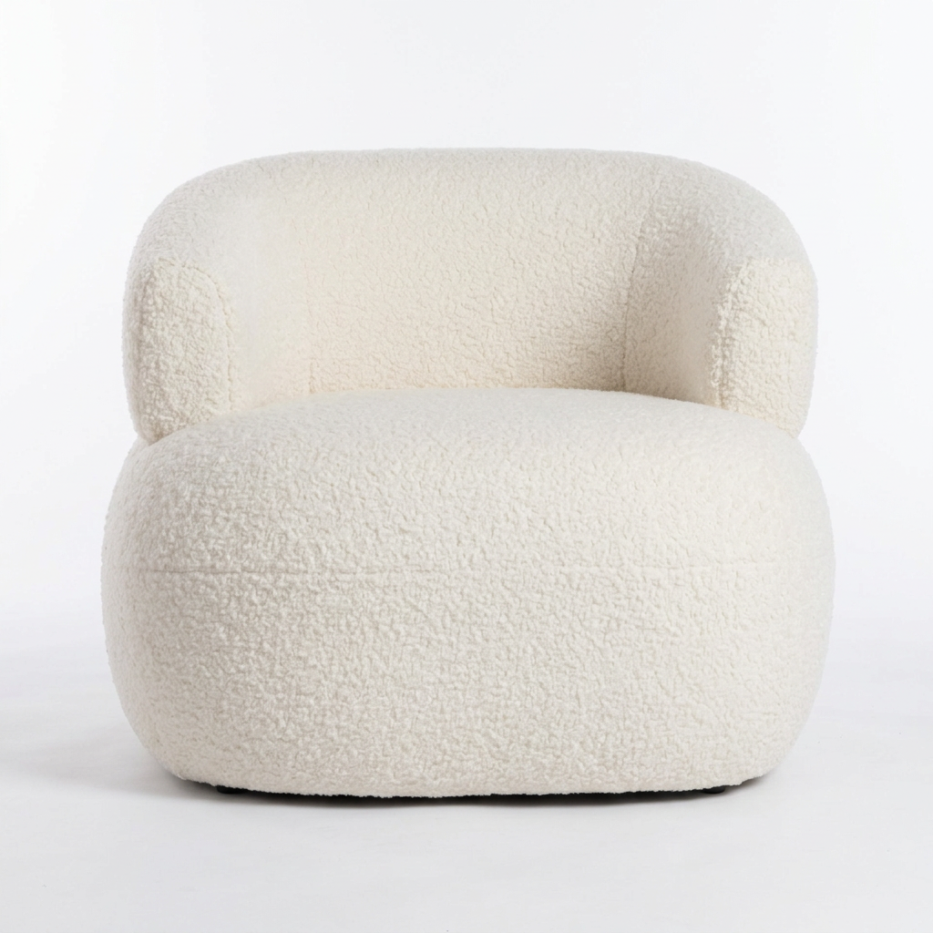 Soreva ivory curved bouclé armchair, front view on white