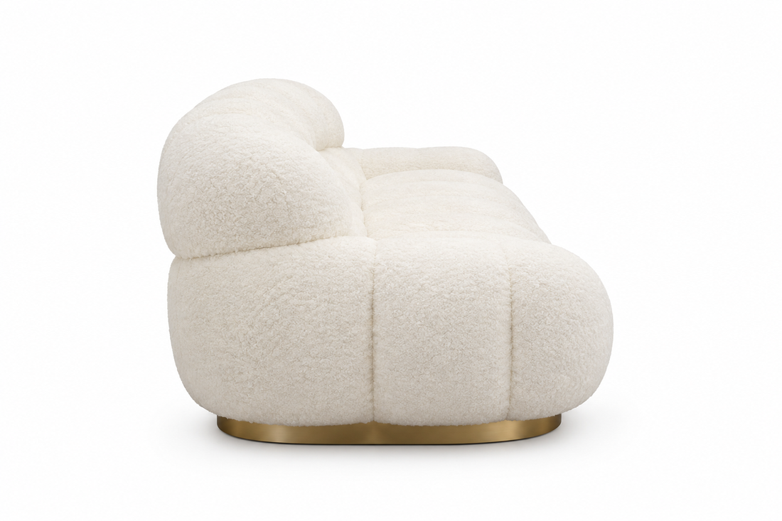 Aveline ivory curved sofa, side view on white background