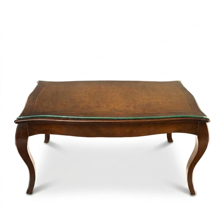 Montelle walnut glass-top coffee table with curved cabriole legs, front view on white background