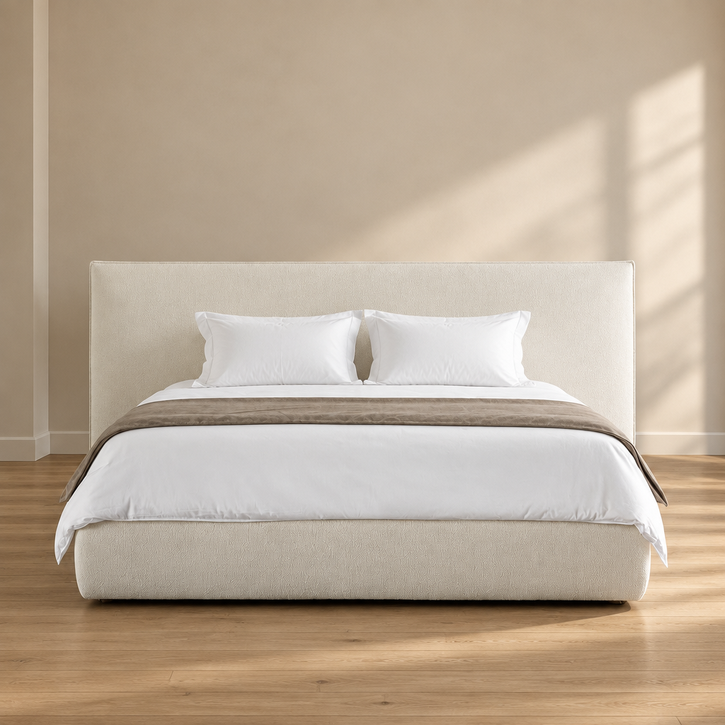 Soma upholstered bed with white bedding in a warm beige room and wood floor