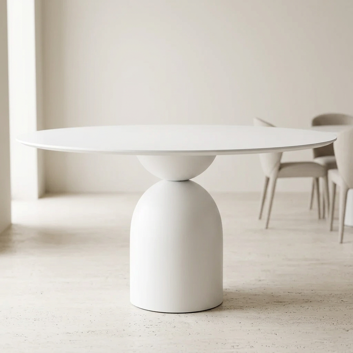 Avelis snow-white round dining table in a contemporary dining room