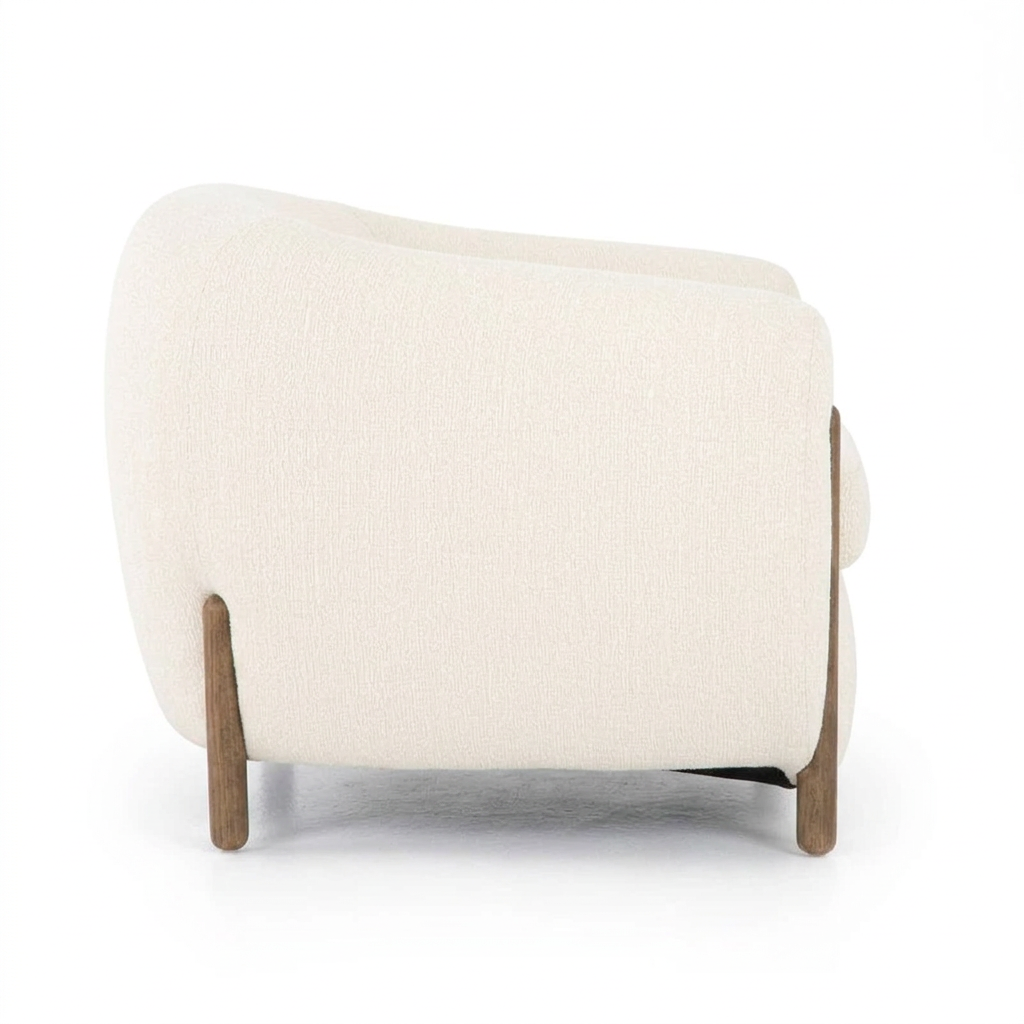 Norvelle ivory barrel armchair, left-side view on white