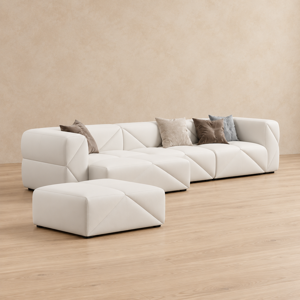 Varen white three-seater sofa shown with matching pouf