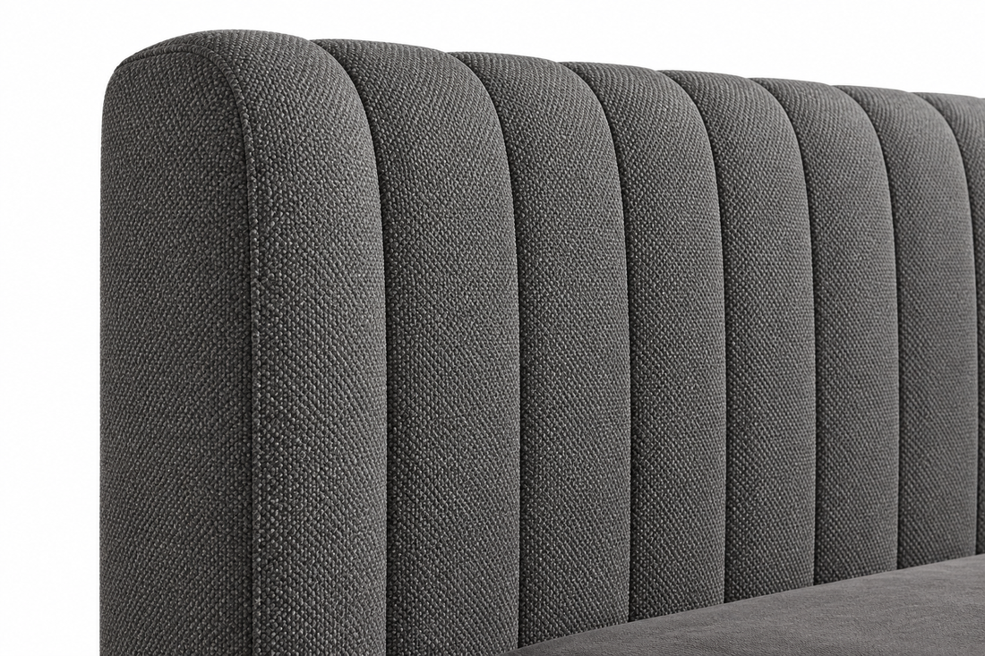 Close-up of gray fabric and channelled upholstery detailing on the Opal bed