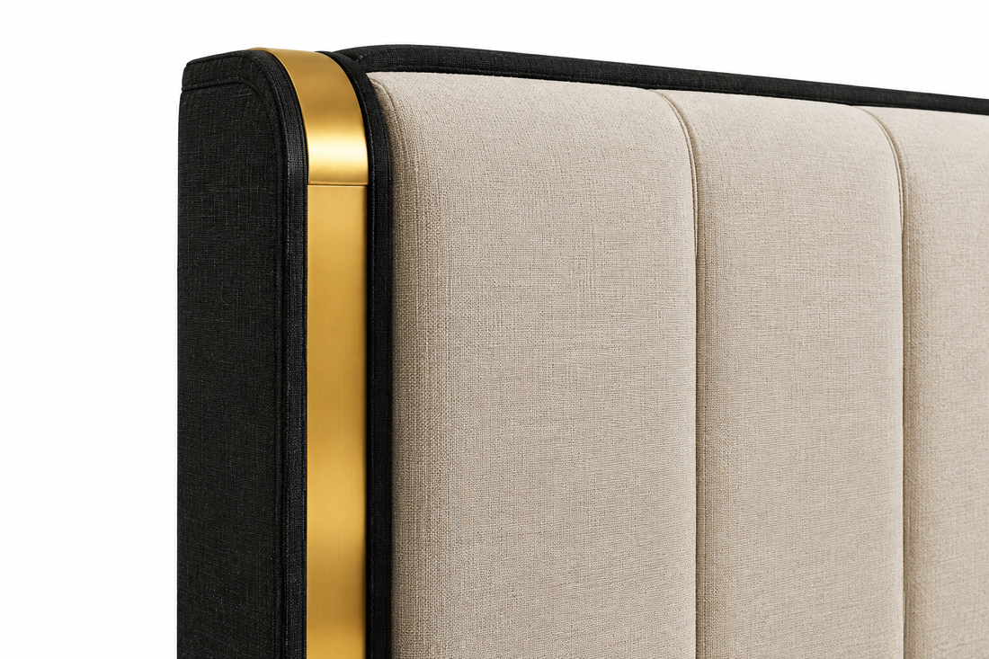 Close-up of the Savanna Majesty bed’s black headboard fabric texture and gold accent detail on a white background