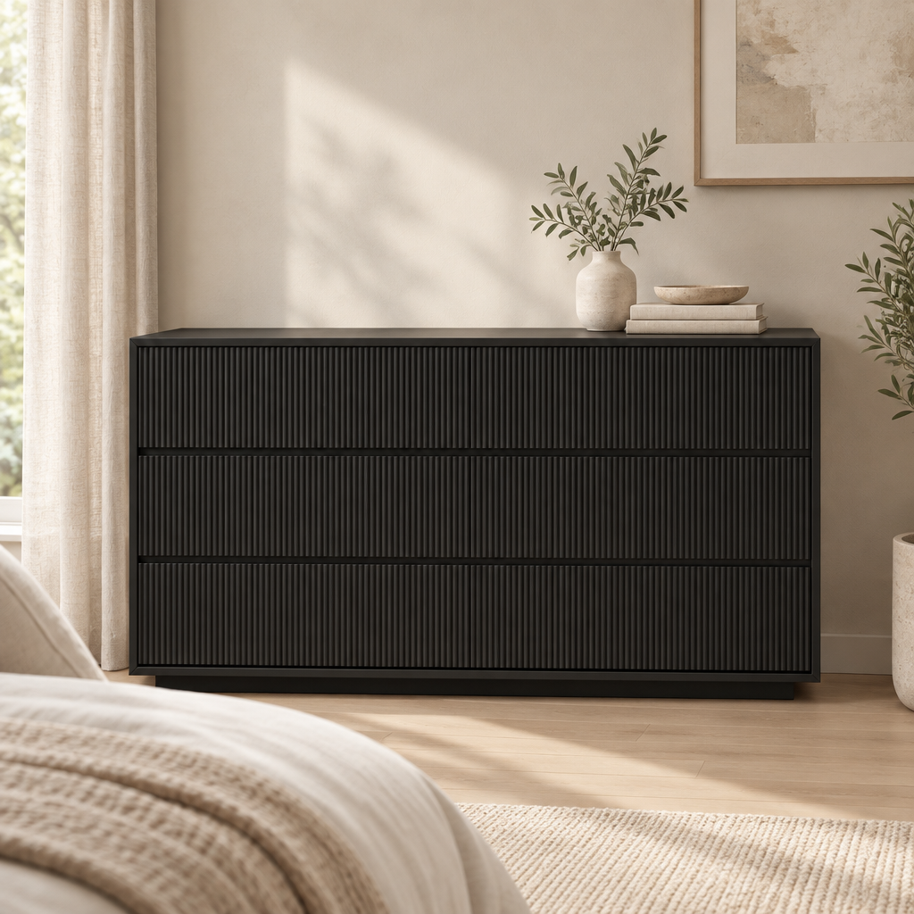 Isola black fluted three-drawer dresser styled in a neutral bedroom